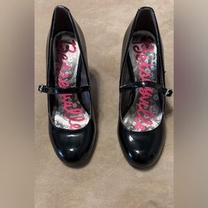 Betseyville black patent leather pumps